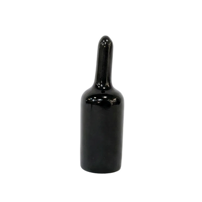 Black bottle-shaped object on a white background