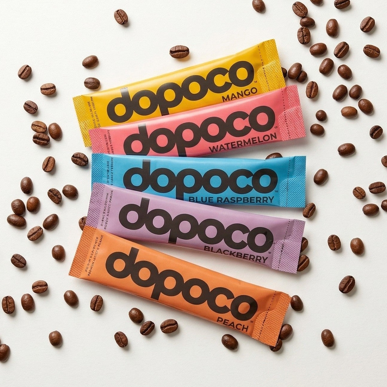 Colorful Dopoco coffee packaging with coffee beans on a white background